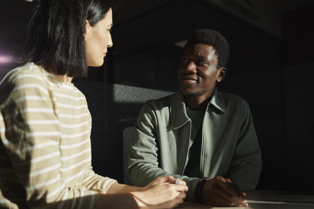 Two people sitting across from each other in conversation